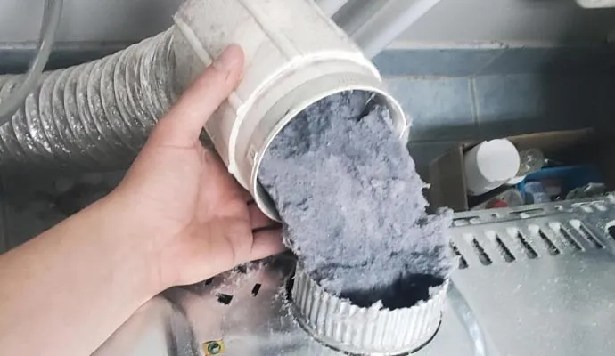 Dryer duct cleaning technician working in Tampa